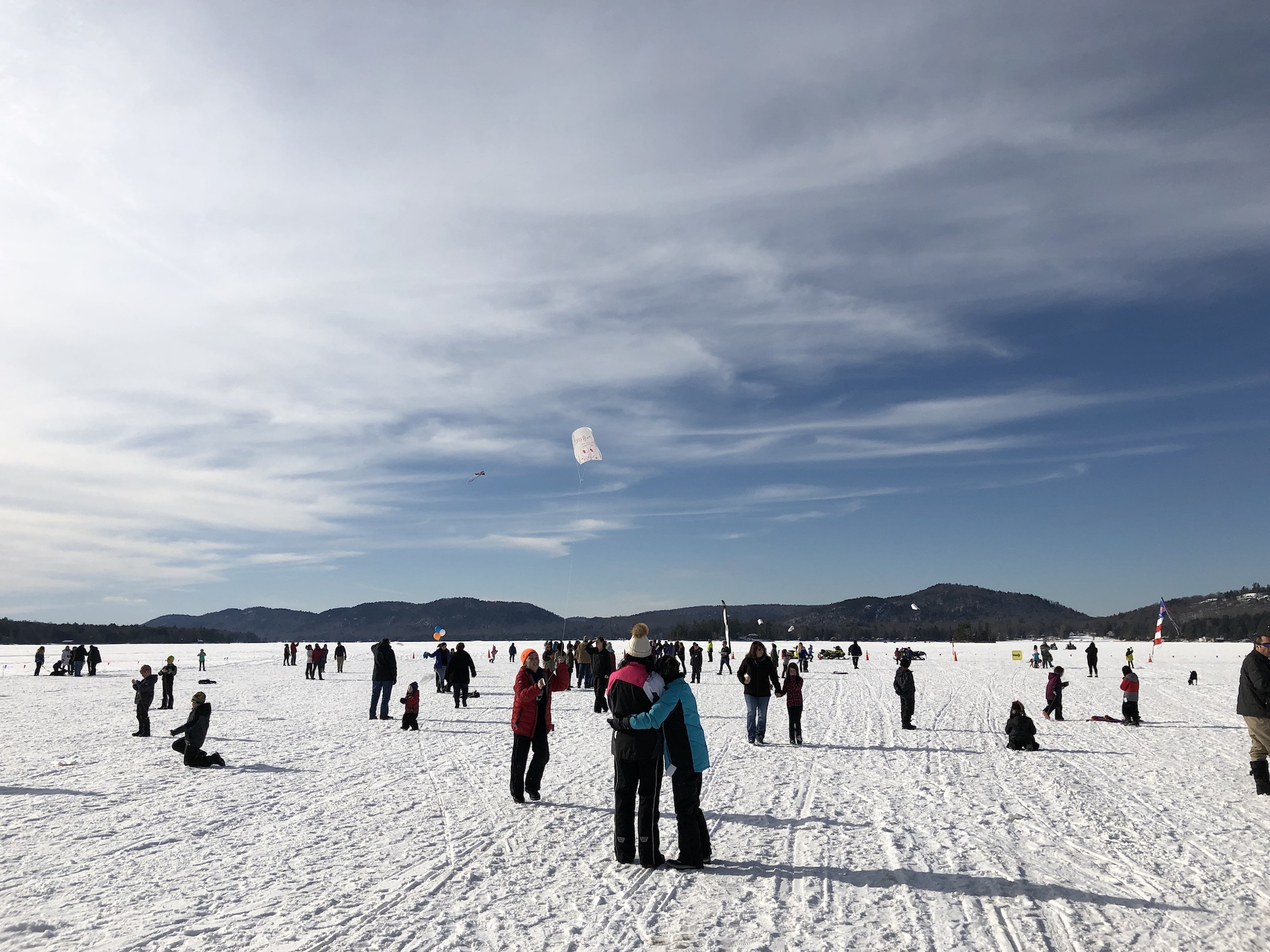 People on the frozen tundra of Fourth Lake off of Arrowhead Park in Inlet, NY